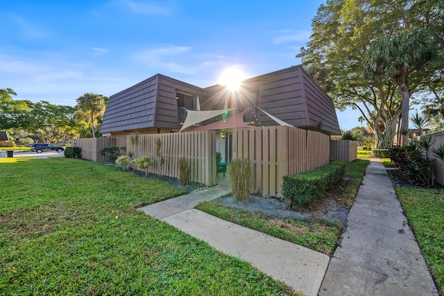 view of property exterior featuring a yard