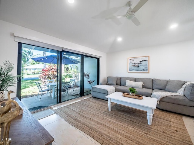 living room with ceiling fan and light tile patterned floors