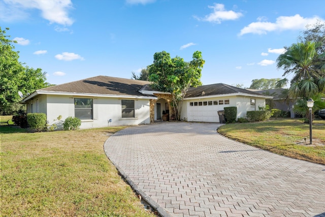 ranch-style home featuring a garage and a front lawn