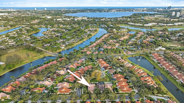 birds eye view of property featuring a water view