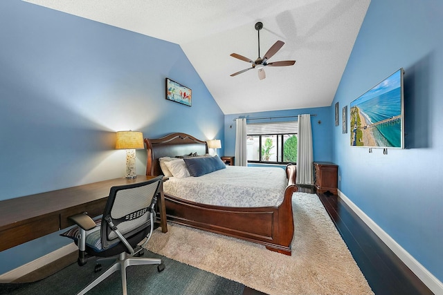 bedroom featuring hardwood / wood-style floors, vaulted ceiling, and ceiling fan