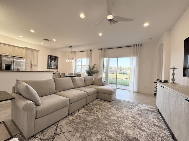 living room featuring ceiling fan