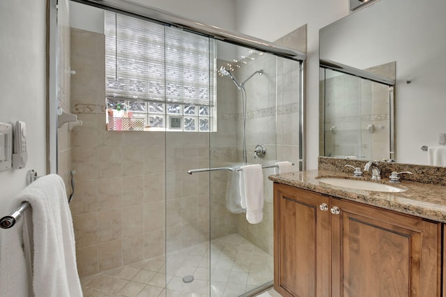 bathroom with vanity and an enclosed shower