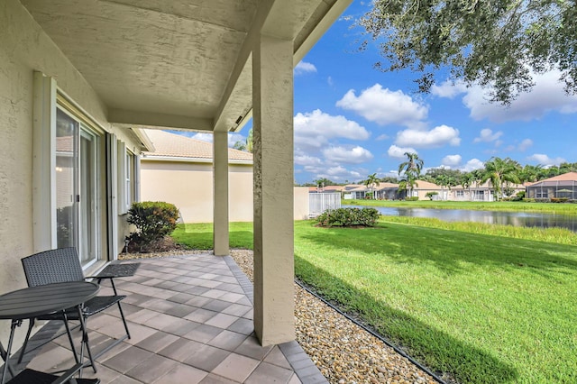 view of patio with a water view