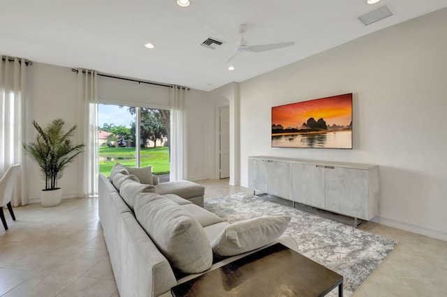 living room with ceiling fan and light tile patterned floors