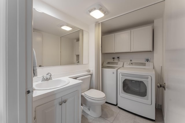 bathroom with tile patterned floors, vanity, toilet, and separate washer and dryer