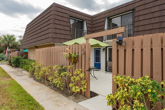 view of home's exterior featuring a balcony