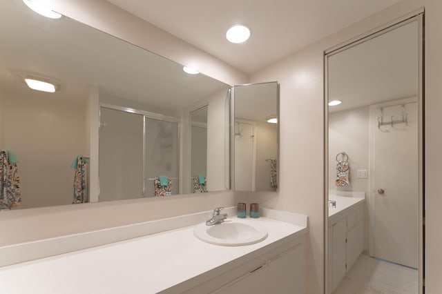 bathroom with vanity and an enclosed shower