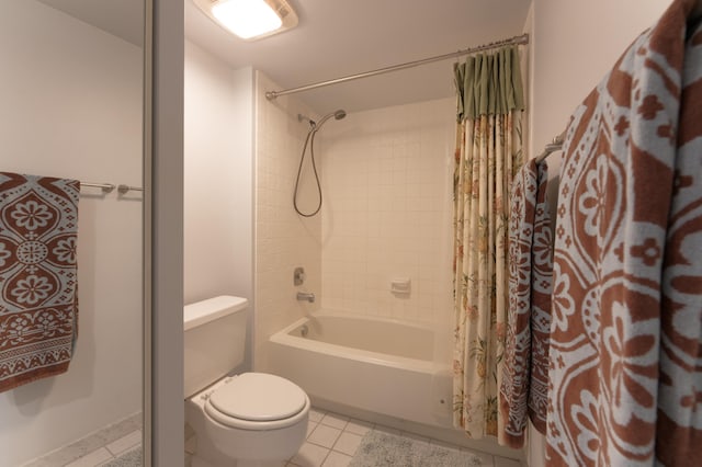 bathroom with tile patterned flooring, shower / bath combo, and toilet