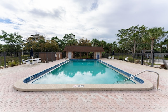 view of pool featuring a patio