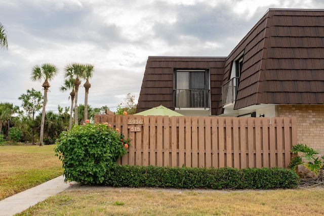 view of home's exterior with a yard