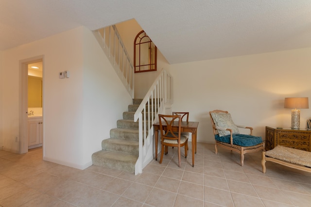 stairs featuring tile patterned floors