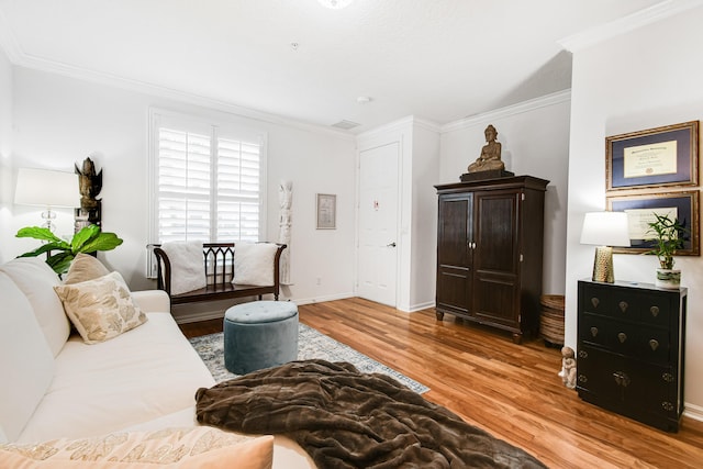 living room featuring wood-type flooring and crown molding