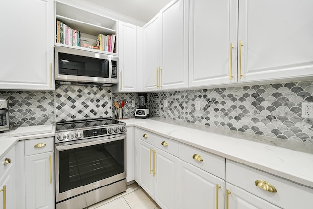 kitchen featuring decorative backsplash, white cabinetry, and appliances with stainless steel finishes