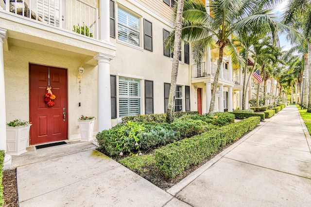 entrance to property with a balcony