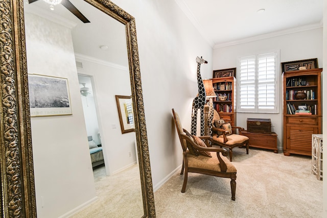 sitting room featuring light carpet and ornamental molding