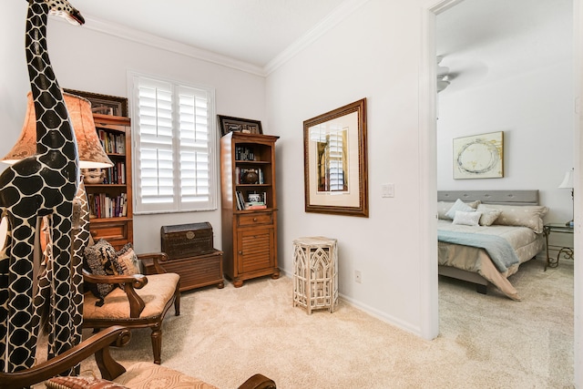 living area with ceiling fan, light colored carpet, and ornamental molding