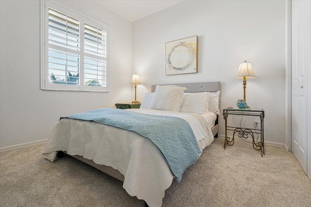 carpeted bedroom featuring a closet