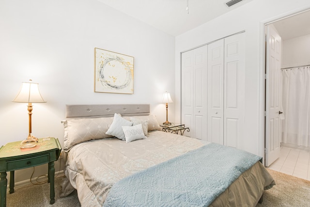 carpeted bedroom with a closet