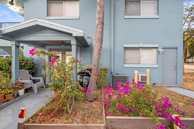 view of front of house with central air condition unit