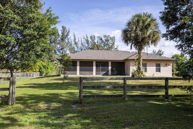 single story home with a front lawn