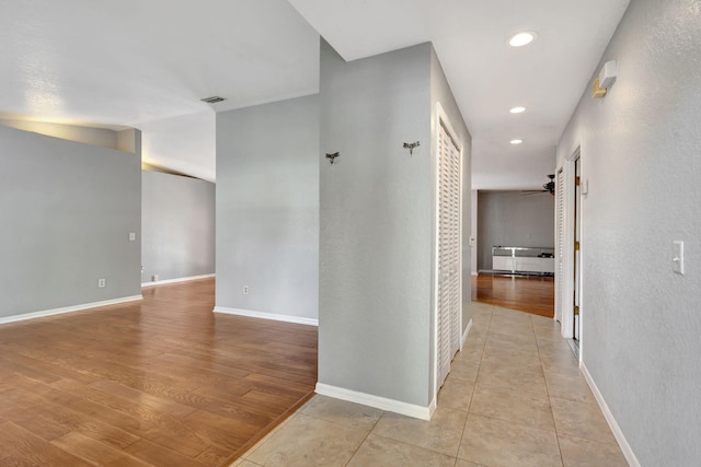 hall with light wood-type flooring