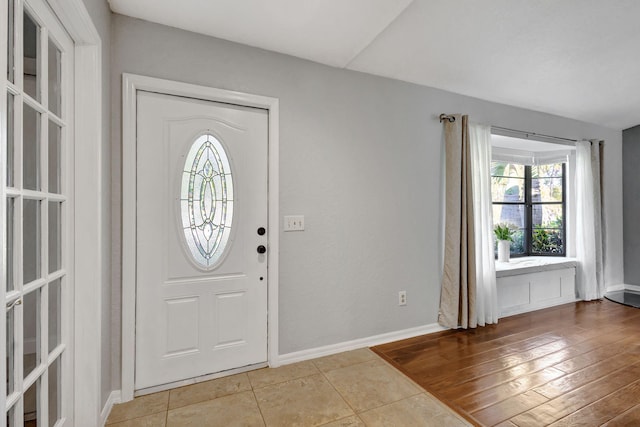 foyer entrance with light wood-type flooring