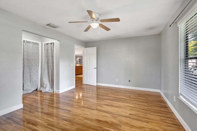 unfurnished bedroom with hardwood / wood-style floors and ceiling fan