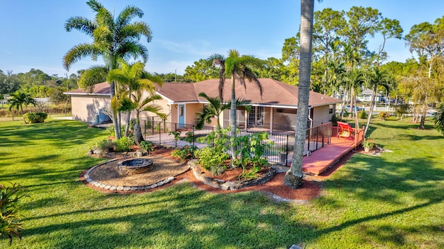 exterior space with a sunroom and a yard