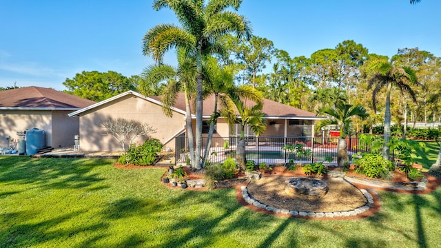 back of house with a lawn and a sunroom