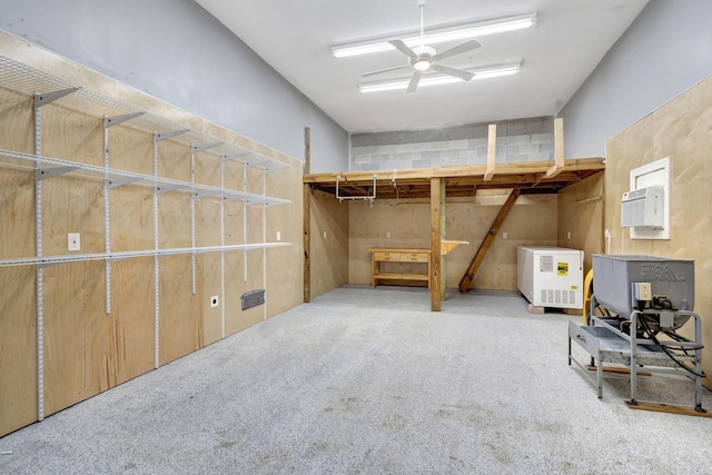 basement featuring ceiling fan and light carpet