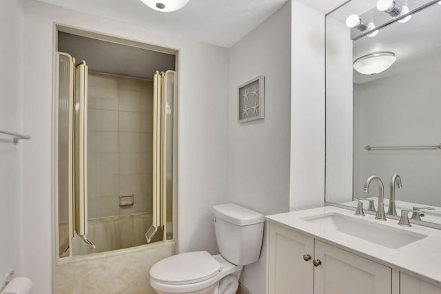 full bathroom featuring vanity, tiled shower / bath combo, and toilet