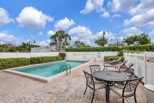 view of pool featuring a patio area