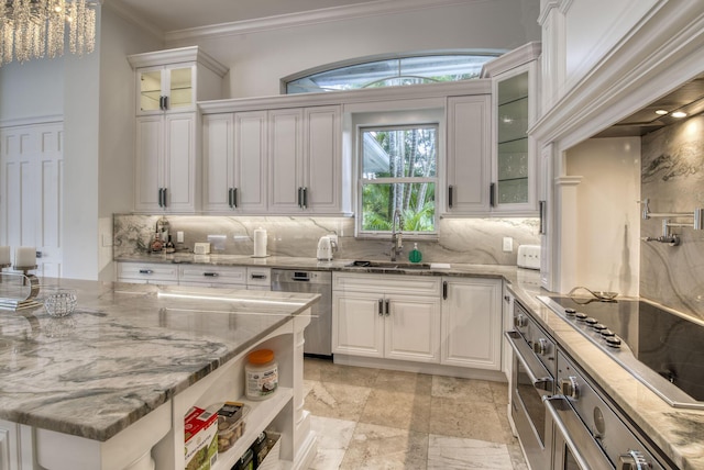 kitchen featuring light stone counters, stainless steel appliances, crown molding, sink, and white cabinetry