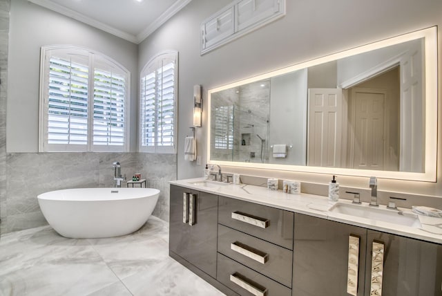 bathroom with plus walk in shower, vanity, tile walls, and crown molding