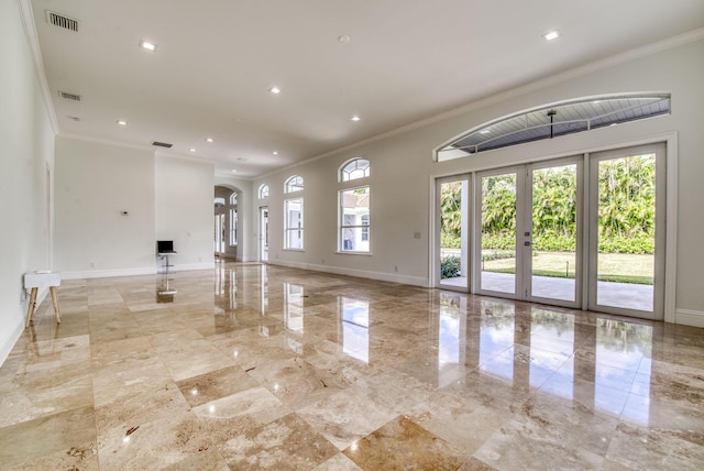 unfurnished living room with french doors and ornamental molding