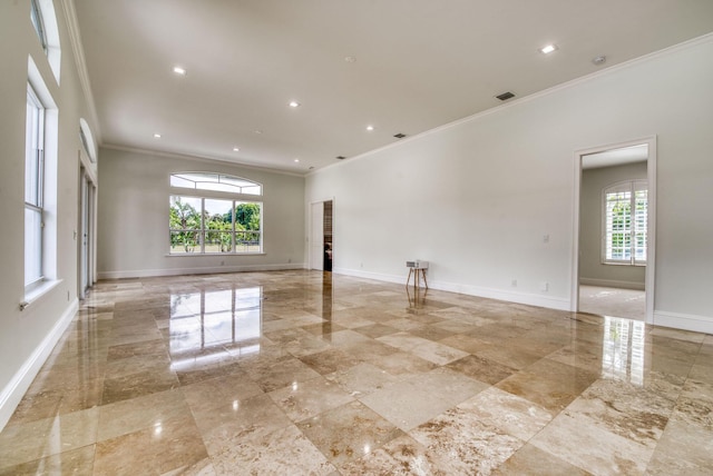 spare room with crown molding