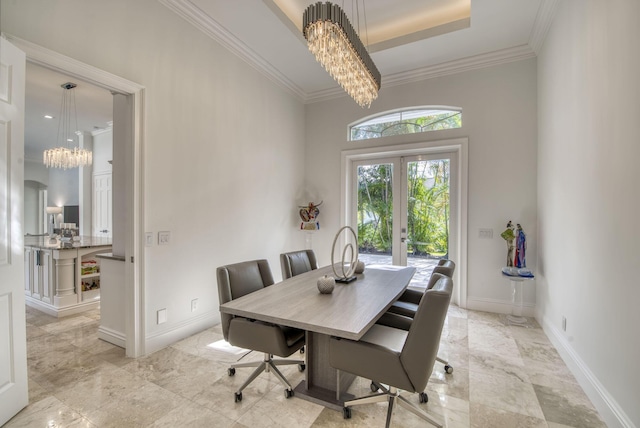 dining space featuring french doors, crown molding, and an inviting chandelier