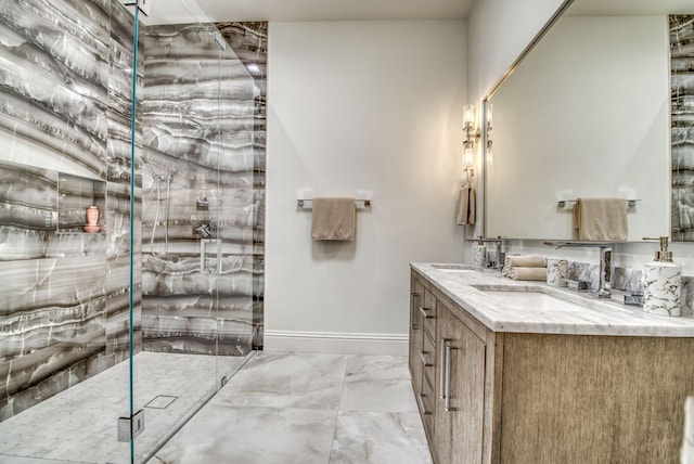 bathroom with vanity and a shower with door