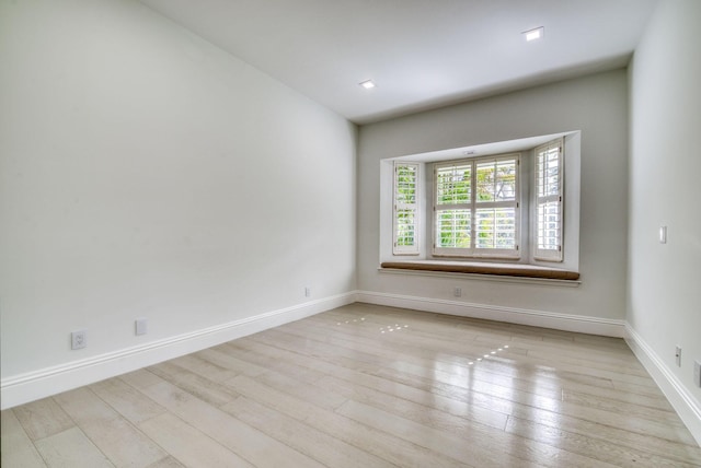 unfurnished room featuring light hardwood / wood-style flooring