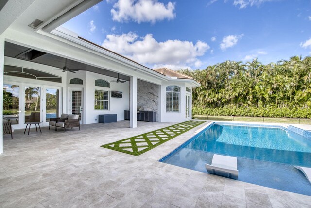 view of patio / terrace featuring area for grilling, ceiling fan, and an outdoor kitchen