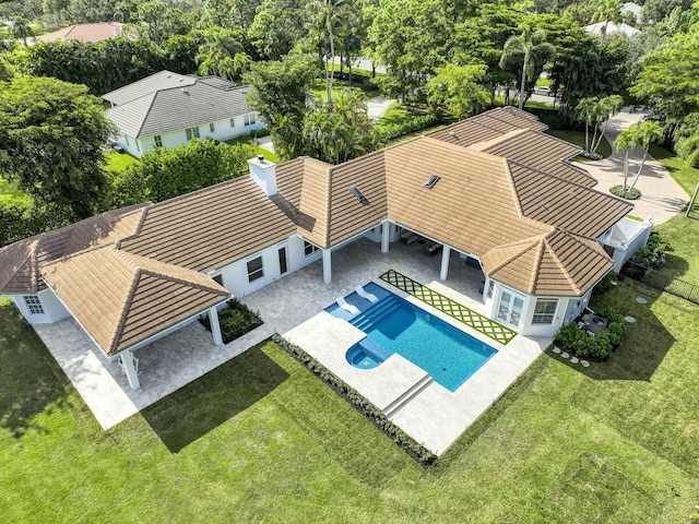 view of swimming pool featuring a yard and a patio