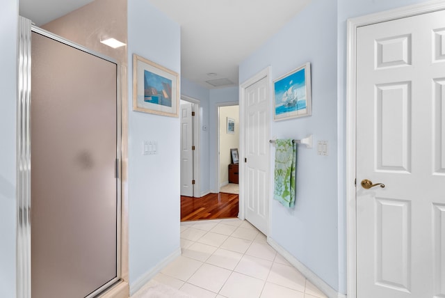 hallway with light tile patterned flooring