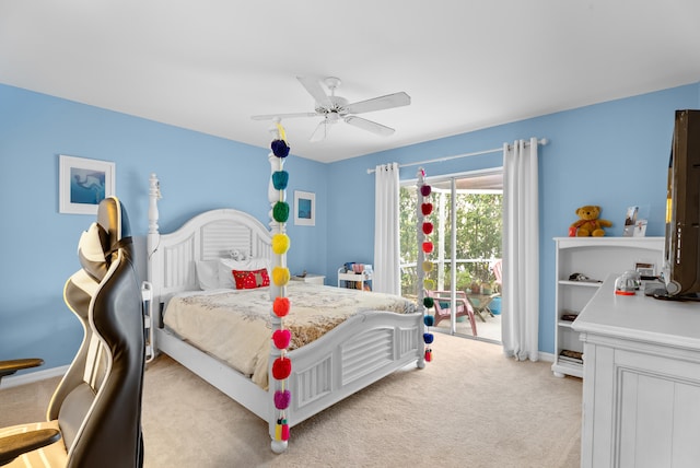 carpeted bedroom featuring access to exterior and ceiling fan