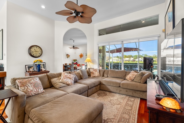 living room featuring ceiling fan and hardwood / wood-style floors