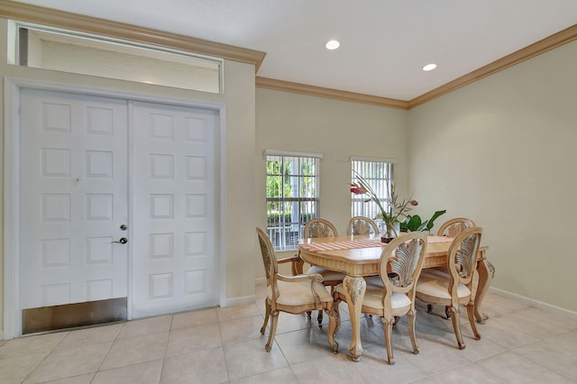 dining area featuring light tile patterned floors and ornamental molding