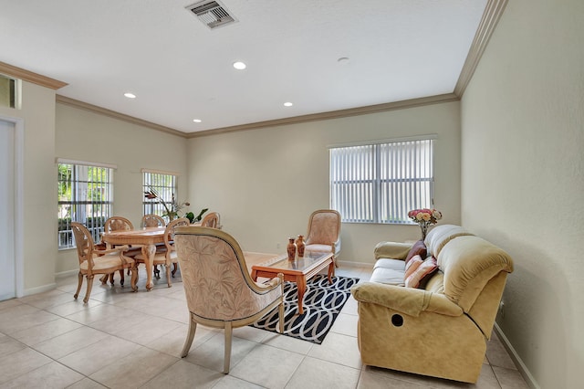 living room featuring light tile patterned floors and crown molding