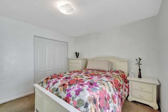 carpeted bedroom featuring a closet