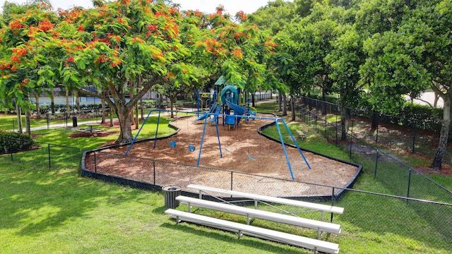 surrounding community featuring a lawn and a playground