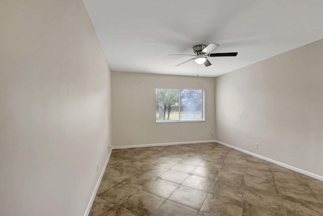 spare room with ceiling fan